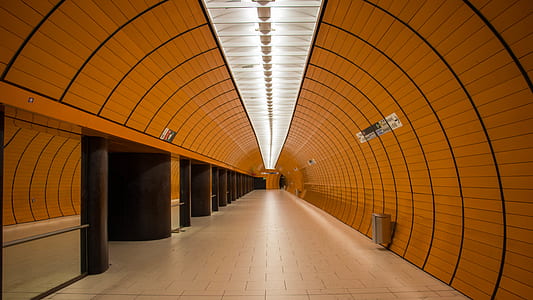 pathway between brown concrete wall thumbnail
