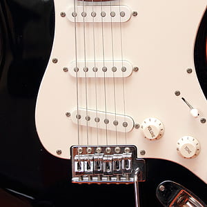 white and black electric guitar thumbnail