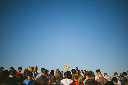 group of people near monstrance thumbnail