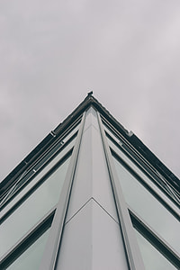 low-angle photography of white concrete building thumbnail
