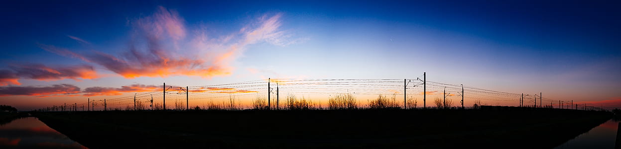 Silhouette of Street Post Light and Grass Under White Cloud and Blue Sky at Daytime thumbnail
