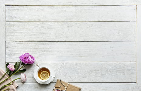 Pink Flowers Beside White Ceramic Cup thumbnail
