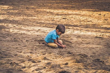 boy grasping sand thumbnail
