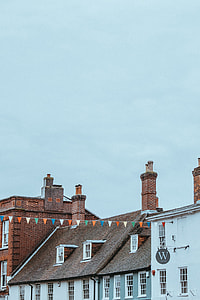 photo of brown house roof under clear sky thumbnail