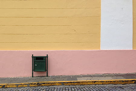 green wooden trash cabinet on wall stret thumbnail