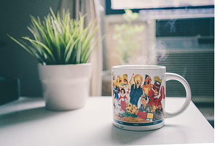 white mug near plant pot thumbnail
