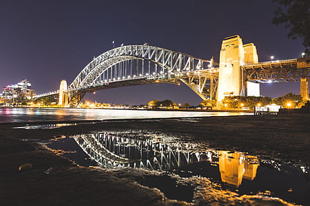 gray concrete bridge above body of water thumbnail