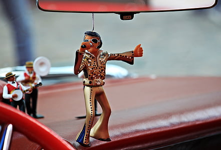 selective focus photography of Elvis Presley ornament hanging on rear view mirror thumbnail
