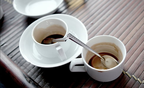 white ceramic coffee mug on white ceramic saucer thumbnail