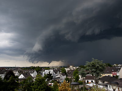 dark clouds above houses thumbnail