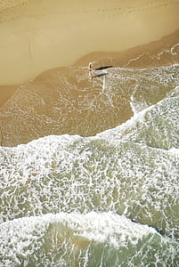 person standing on seashore thumbnail