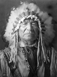 grayscale photography of male native American thumbnail