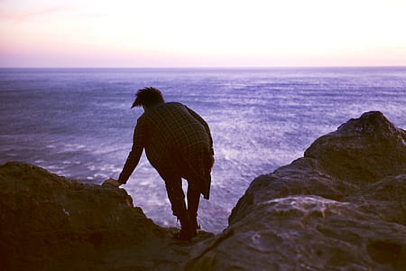 person on edge of cliff thumbnail