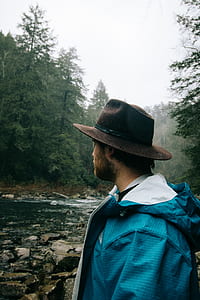 man standing near river thumbnail