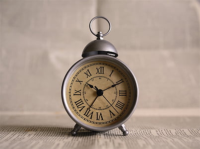 gray framed analog desk clock on paper thumbnail