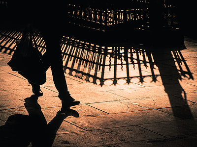 man walking holding hand bag thumbnail