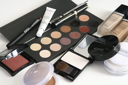 assorted-color makeup palettes on white surface thumbnail