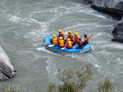 aerial photography of group of people riding inflatable boat thumbnail