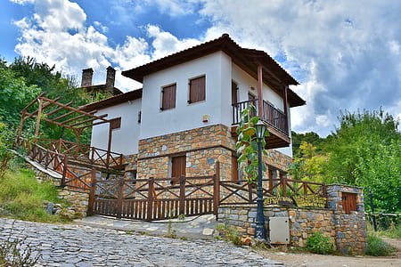 white and beige concrete 2-storey house at daytime thumbnail