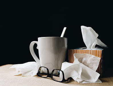 black framed eyeglasses beside white ceramic mug thumbnail