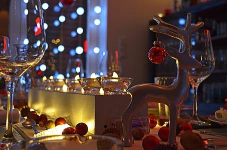 red ornament on brown deer figurine thumbnail