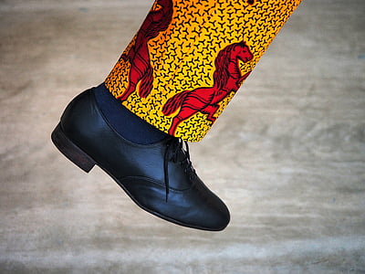 person wearing black leather shoe thumbnail