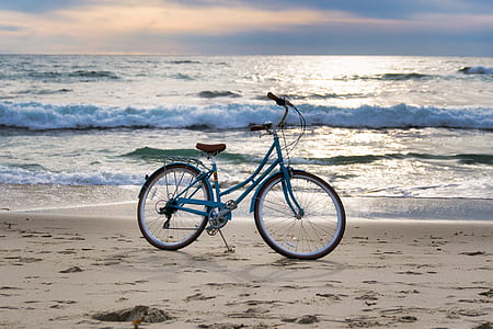 blue cruiser bicycle on seashore thumbnail