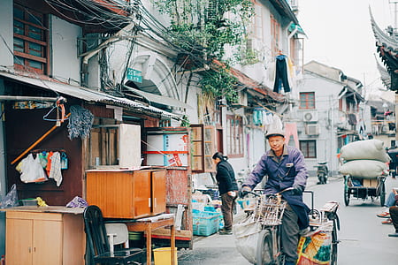 man riding on bicycle during daytime thumbnail