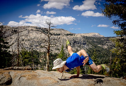 man hand standing on boulder thumbnail