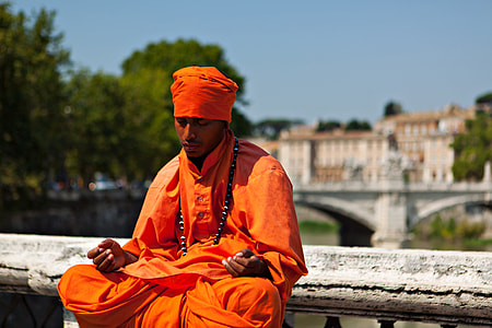 Candid shot of a man in thought and meditation. Image captured on the River Tiber in Rome, Italy thumbnail