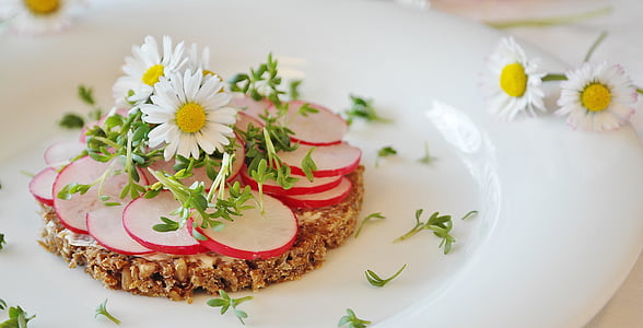 daisy flower on white ceramic plate thumbnail