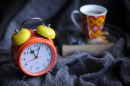 red and yellow twin-bell alarm clock at 11:03 thumbnail