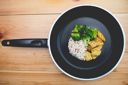 cooked rice, meat, and broccoli in frying pan thumbnail