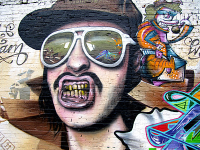 man in brown cap and aviator sunglasses graffiti thumbnail