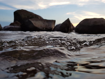 rock formation surrounded of body of water thumbnail