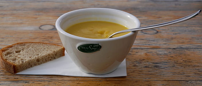 photo of white ceramic bowl of soup and bread thumbnail