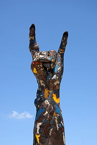 multicolored hand themed statue at daytime thumbnail
