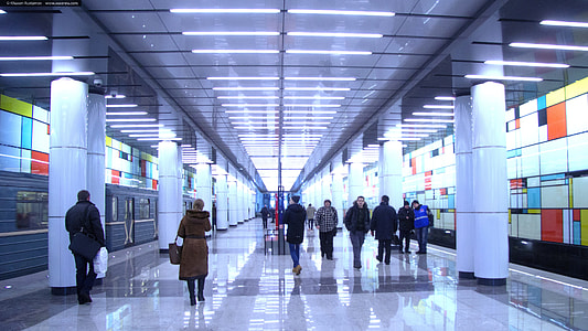 group of people inside building lights turned on thumbnail