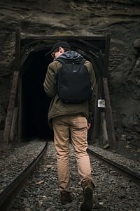 man walking on railroad thumbnail