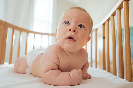 child on crib thumbnail