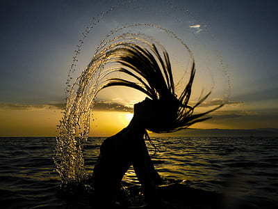 silhouette of a woman in body of water thumbnail