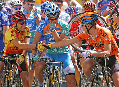 three men riding on bike wearing helmets thumbnail