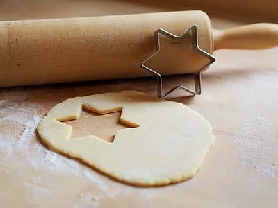 silver star of David cookie cutter beside dough thumbnail