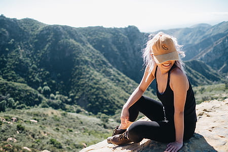 woman sitting on mountain thumbnail