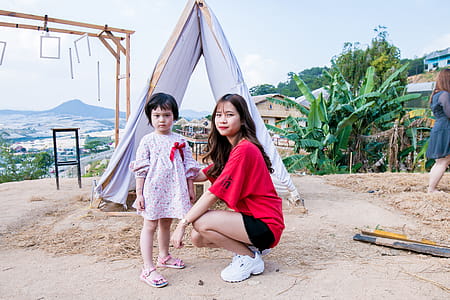 Woman Beside Gift in Front of Tent thumbnail