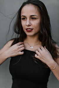 woman wearing black crew-neck sleeveless top thumbnail