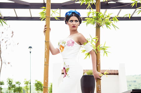 Woman Standing Between Bamboos thumbnail