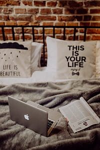 Enjoying evening with a Macbook in a nice bed thumbnail
