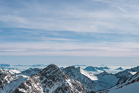 aerial view of snowy peak mountains thumbnail