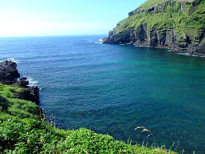 islet near body of water thumbnail